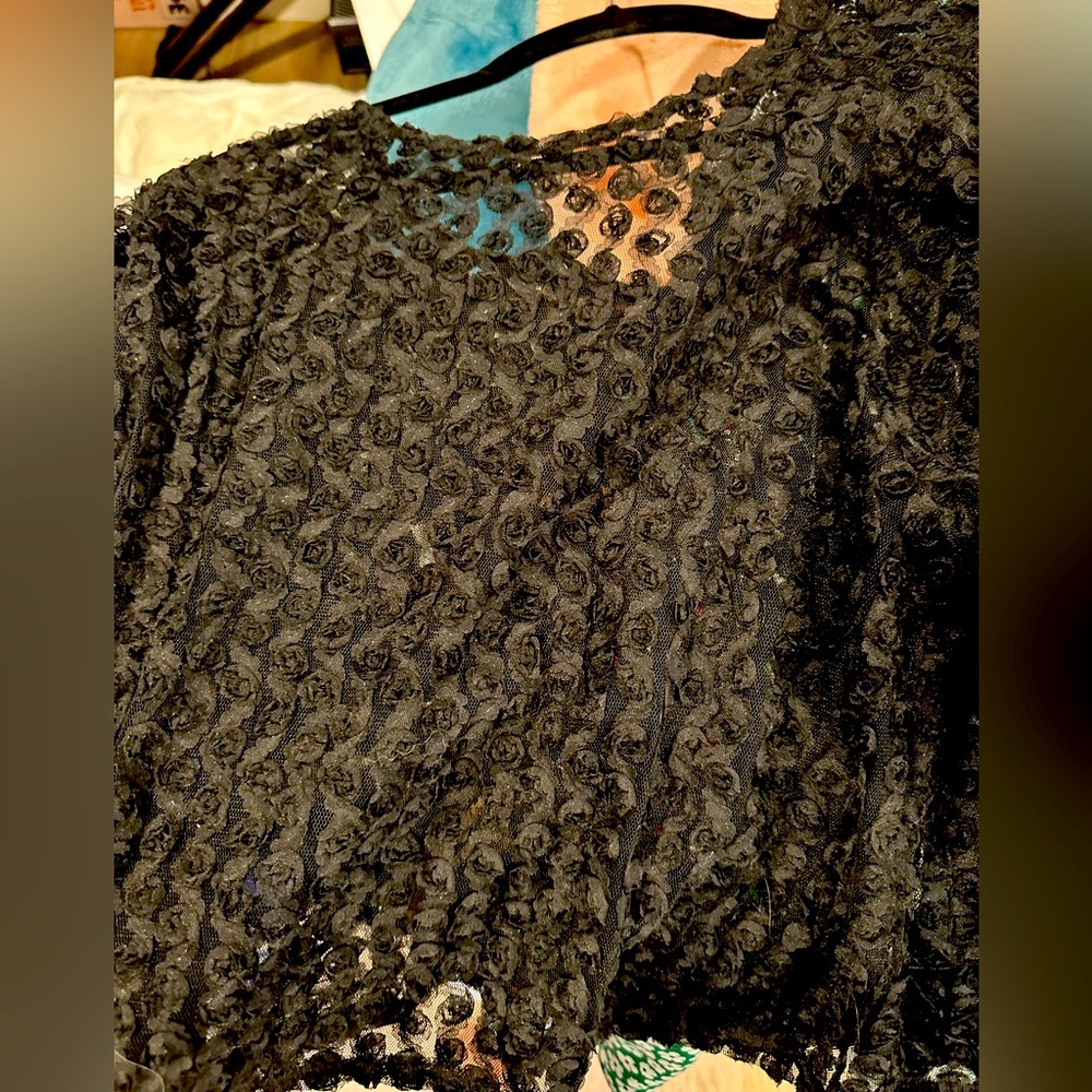 Black mesh with rosettes top. 3/4the sleeve size Medium. NWOT. Never worn.
